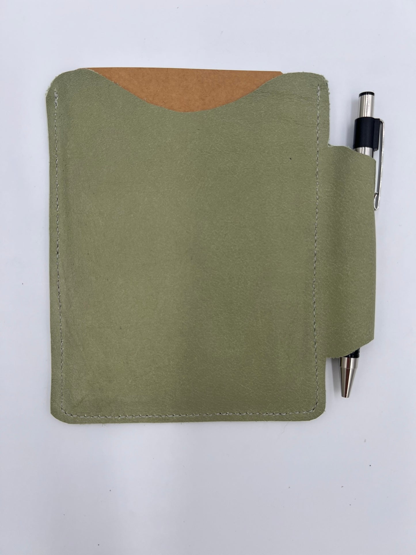 Handmade leather journal case with attached pen carrier