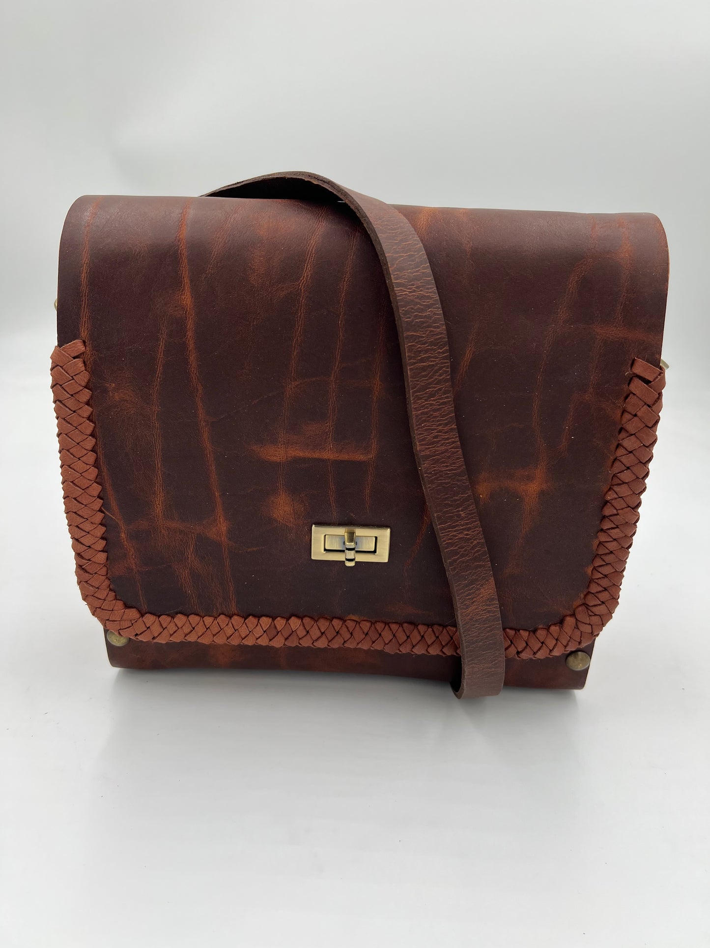Dark brown crazy horse leather bag with oak sides and lace detail