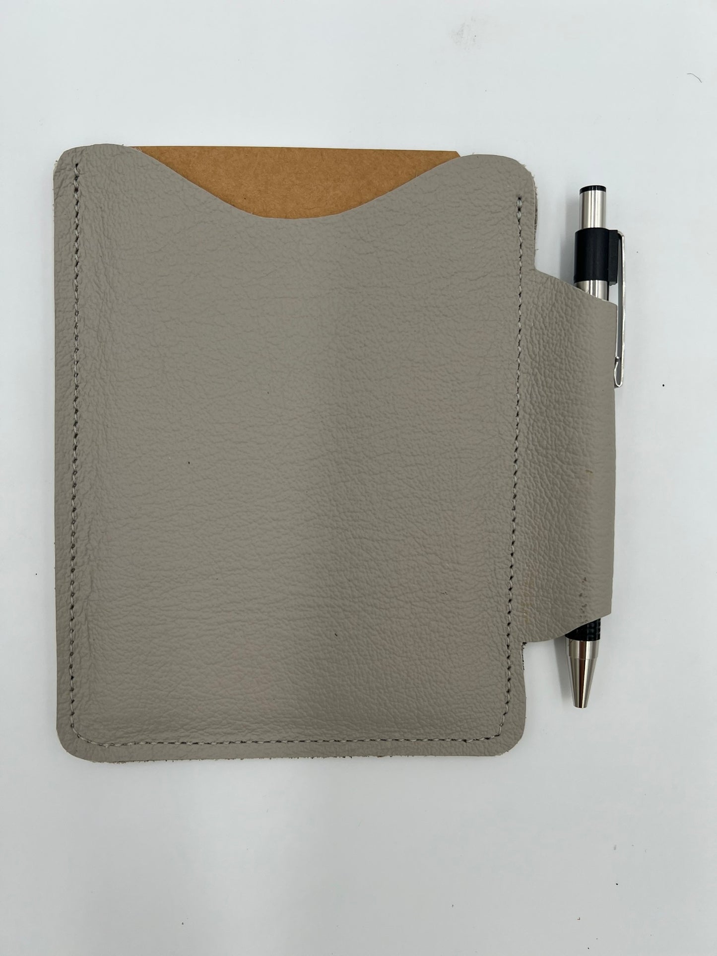 Handmade leather journal case with attached pen carrier