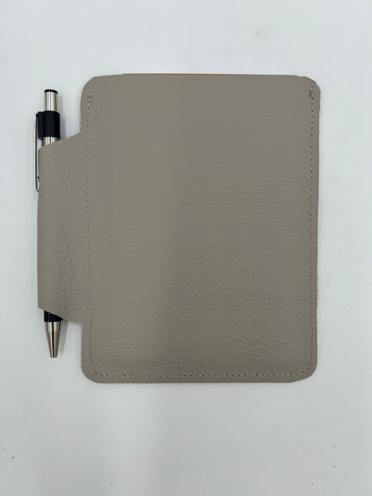 Handmade leather journal case with attached pen carrier