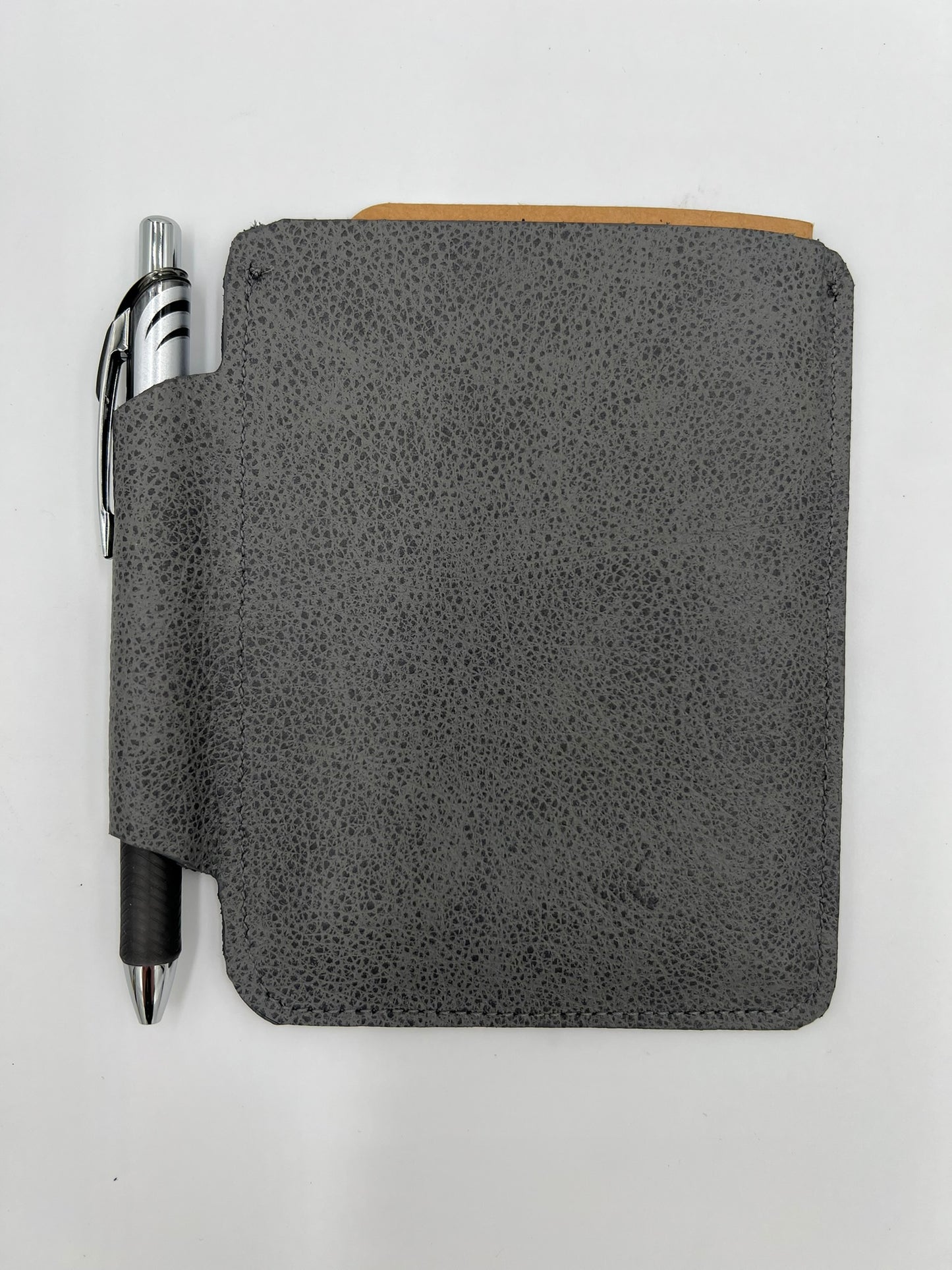 Handmade leather journal case with attached pen carrier