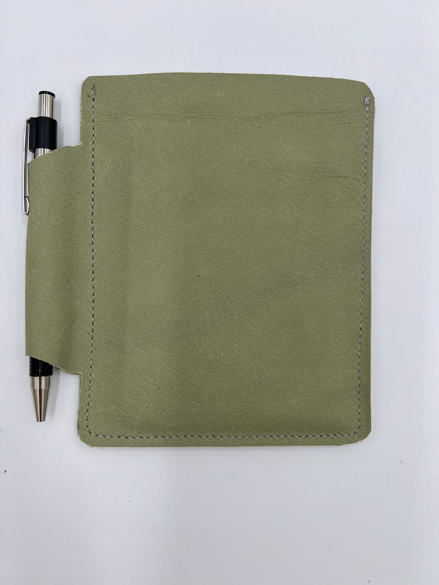 Handmade leather journal case with attached pen carrier