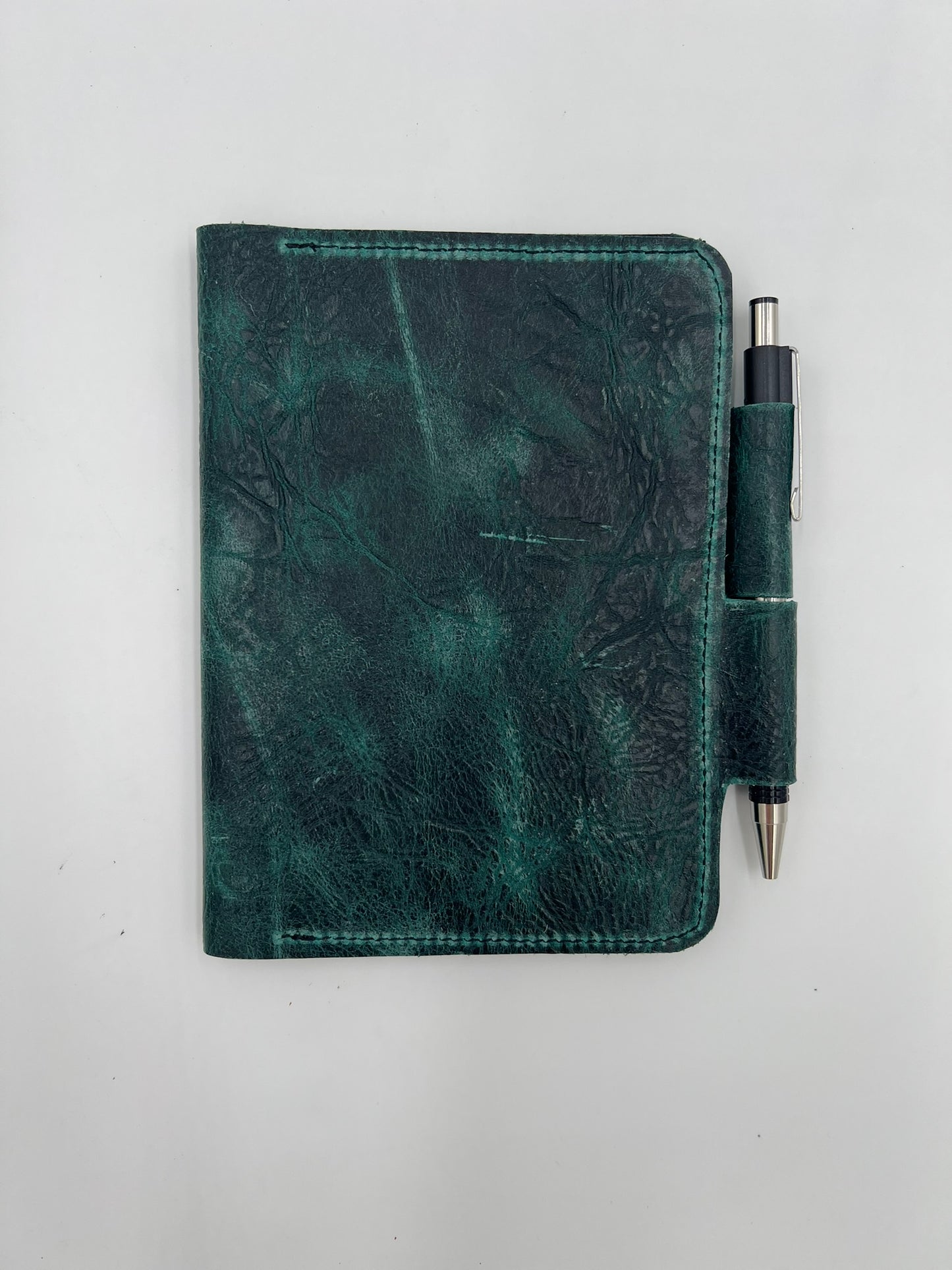 Handmade leather journal cover with card slot and pen holder